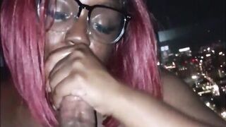 Sexy dark skinned girl sucks dick and takes cum in the face with a nice city view