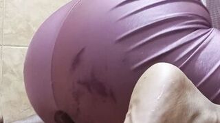 Horny brunette gets a dildo in her wet and hairy pussy until she makes a big squirt all over the floor