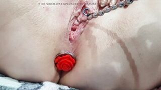 Sounding masturbation of a pierced wet crack with an anal plug